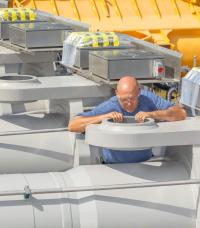 Long stroke hydraulic cylinders receiving final inspection before integration with hydroelectric dam's custom hydraulics.