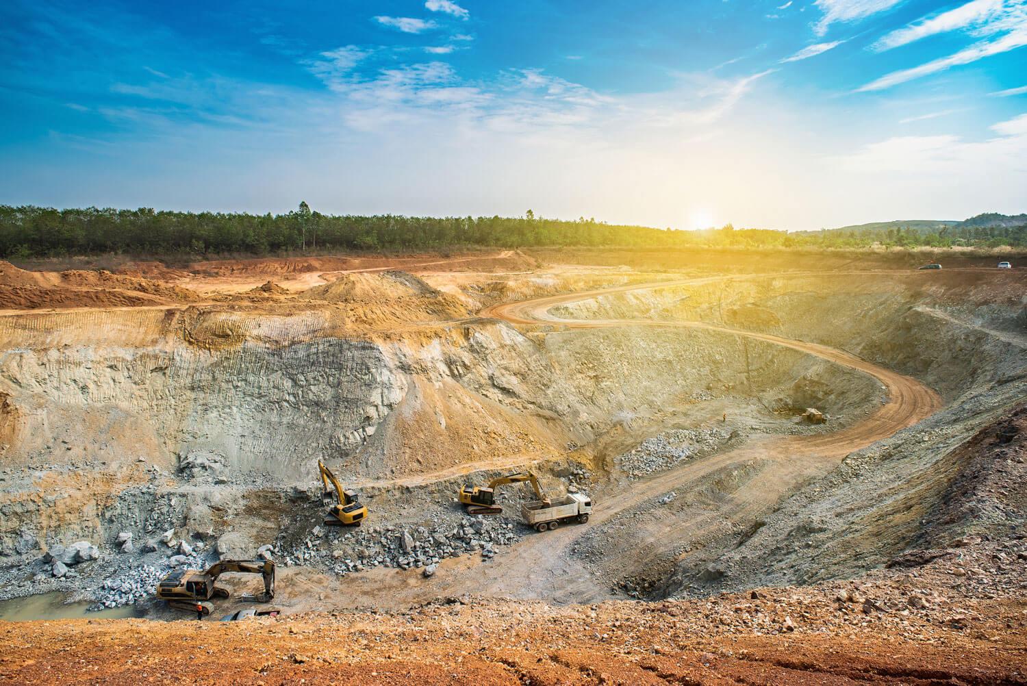 Quarry with mining machinery on a sunny day